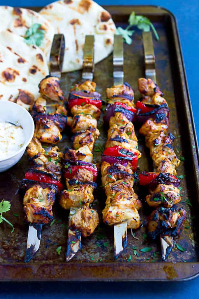 Up your grilling game with these flavorful Tandoori Grilled Chicken Kabobs. Serve them up with grilled naan bread and yogurt for an amazing meal! 188 calories and 4 Weight Watchers Freestyle SP #chicken #kabobs #wwfreestyle