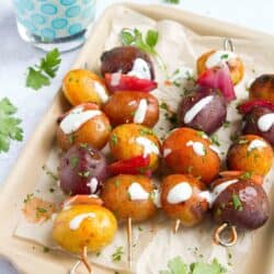 Kick up your side dish game with these Buffalo Grilled Potato Skewers. Drizzled with a yogurt blue cheese sauce, they're perfect for summertime entertaining. 72 calories and 3 Weight Watchers Freestyle SP #potatoes #grilling #weightwatchers