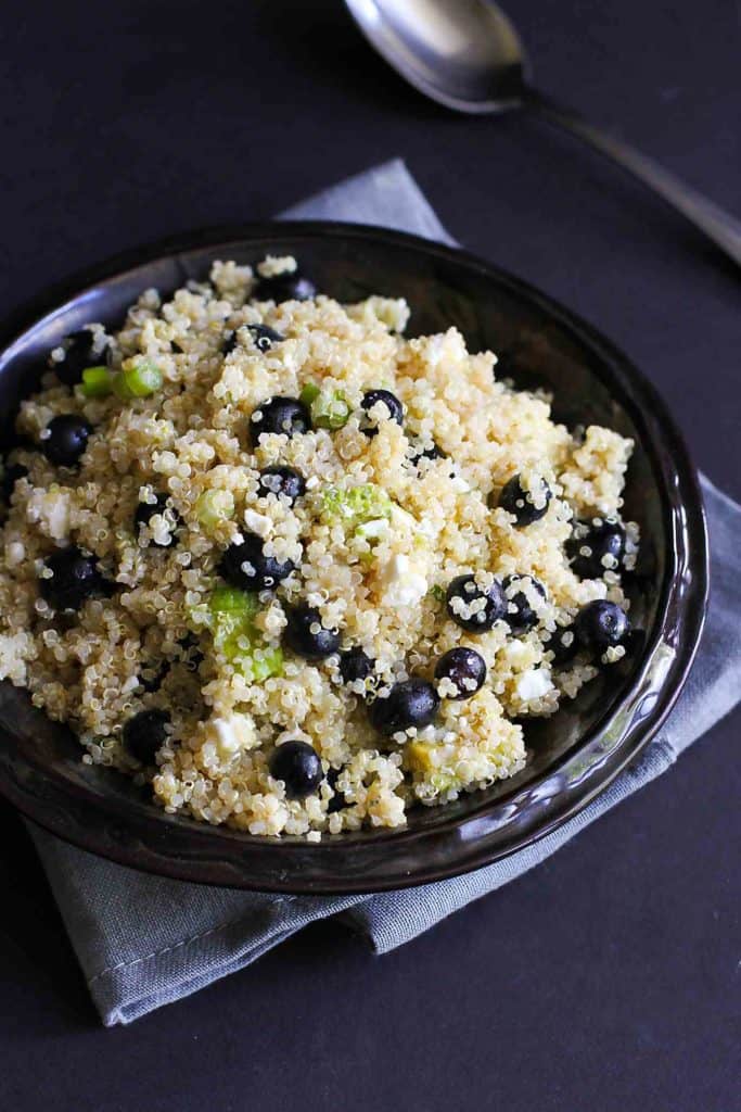 Punch up the flavors of your summertime meal with a dose of this Quinoa, Avocado and Blueberry Salad, finished off with feta cheese and a tangy lime vinaigrette. The perfect potluck salad! 121 calories and 4 Weight Watchers Freestyle SP #quinoa #saladrecipes #weightwatchers
