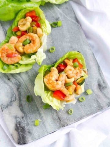 Cashew shrimp is always a favorite takeout meal, but it's super simple (and healthier!) to make at home. Cook up a batch and serve as lettuce wraps for a light meal or appetizers. 169 calories and 3 Weight Watchers SP #shrimp #weightwatchers #lettucewraps