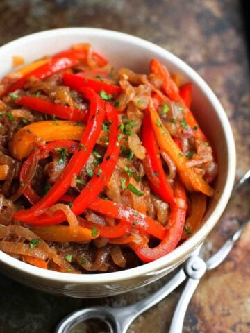 This balsamic peppers and onions recipe is so easy and versatile that we often make a double batch and store the leftovers in the freezer for another meal. Serve them on sausage, chicken or even pizza. 94 calories and 1 Weight Watchers Freestyle SP #vegan #peppersandonions #healthyrecipes