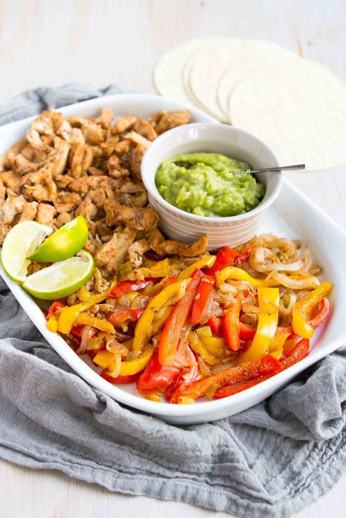 Chicken fajitas - Instant Pot or stovetop - are an easy, healthy and colorful meal that the whole family loves. Serve with tortillas and guacamole. 238 calories and 0 Weight Watchers SP #wwfreestyle #heatlhyrecipes #30minutemeals