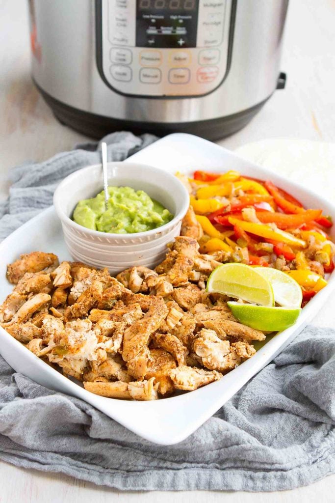 Instant Pot Chicken Fajitas with peppers and onions is a super quick, easy meal that the whole family loves. No worries if you don't have a pressure cooker - stovetop instructions are included. 238 calories and 0 Weight Watchers SP #instantpot #fajitas #pressurecooker #chickenrecipes