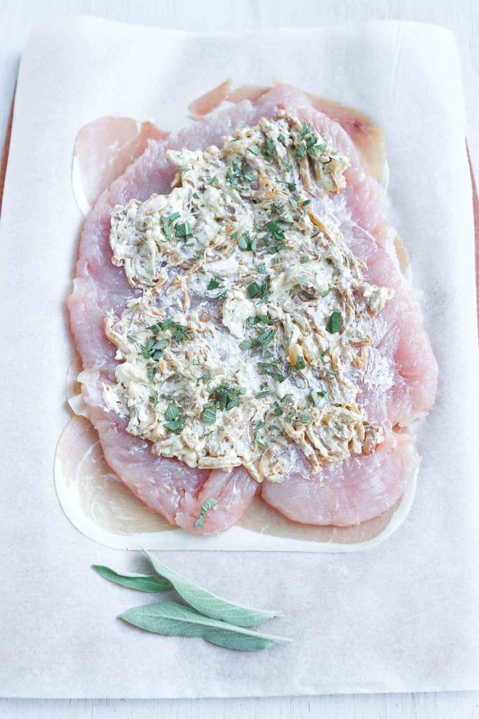 Flattened turkey breast, covered in cream cheese, caramelized onions and minced sage.