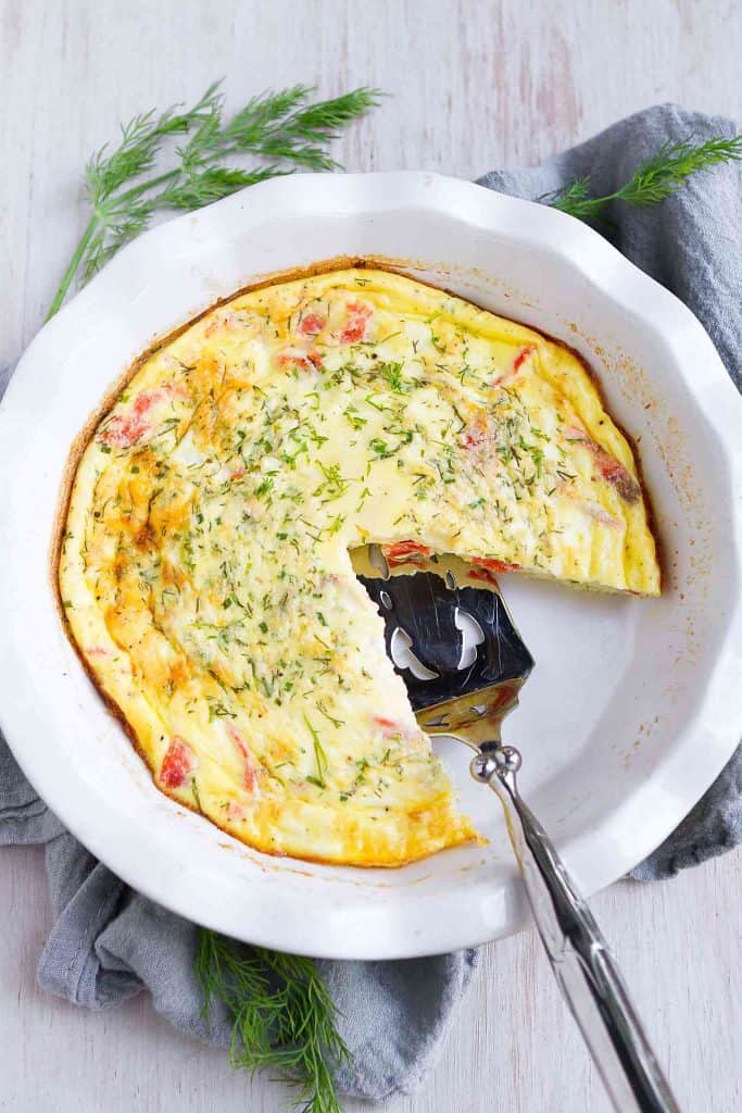 Sunday brunch, holiday breakfast or Mother's Day - this crustless smoked salmon quiche recipe covers all the bases. Creamy and savory, thanks to goat cheese and a secret ingredient. 119 calories and 1 Weight Watchers SP | Recipes | Easy | Healthy | Low Carb | No Crust #crustlessquiche #brunchrecipes #smartpoints #weightwatchers