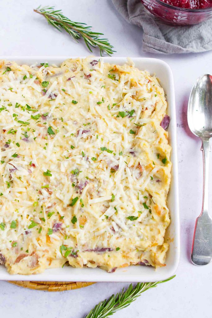 This tasty Loaded Mashed Potato Casserole is filled with bacon and caramelized onions. Great make ahead option for the holidays! 141 calories and 4 Weight Watchers SP | Thanksgiving | Holidays | Make Ahead | Side Dishes | With Cream Cheese | Easy | Without Sour Cream | For A Crowd #thanksgivingrecipes #mashedpotatocasserole #mashedpotatoes #thanksgivingrecipes #Creamerpotatoes