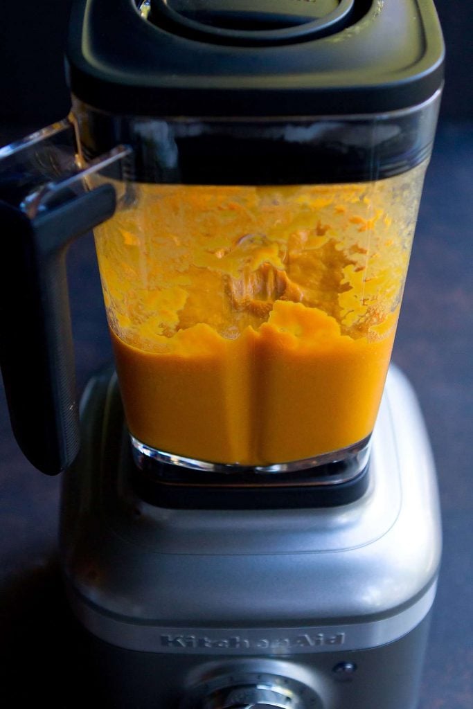 Pureed carrot soup in a blender