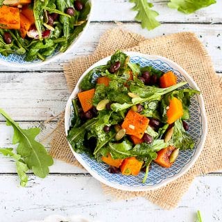 Treat yourself to this colorful, healthy and vegan roasted butternut squash salad. The sriracha lime dressing adds a great kick! 219 calories and 2 Weight Watchers SP | Warm | Arugula | Vegan | Vegetarian | Black Beans | Healthy #butternutsquash #squashrecipes #meatlessmonday #vegetarianrecipes #dinnerrecipes