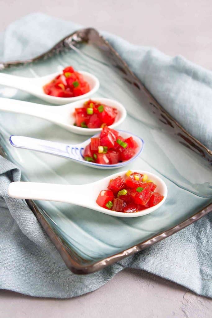 These ahi tuna poke appetizers take just 10 minutes to make, and are fantastic for New Year's Eve or cocktail parties. So much flavor in every bite! 21 calories and 0 Weight Watchers SP | Recipe | Appetizer | Healthy | Easy | Hawaiian | Marinade #tunapoke #ahirecipes #newyearseve #horsdoeuvres #easyappetizers #smartpoints