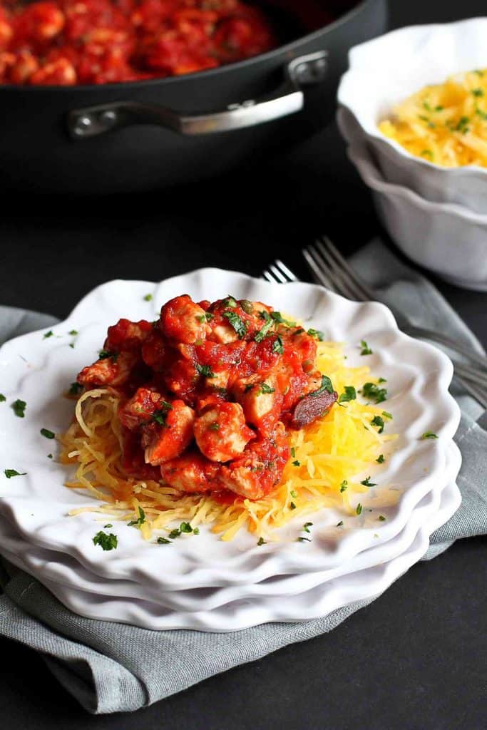 Spaghetti squash makes a fantastic, healthy meal when topped with an easy chicken puttanesca sauce. 220 calories and 1 Weight Watchers SP | Recipe | Authentic | Spicy | Gluten Free | Easy | Quick | Recipes #puttanescasauce #chickenrecipes #spaghettisquash #smartpoints #weightwatchers