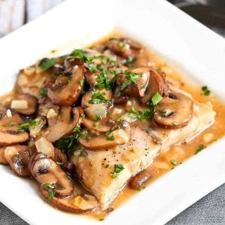 Tender white fish fillets are baked and smothered in a Marsala wine mushroom sauce for a healthy, delicious baked halibut recipe. 315 calories and 4 Weight Watchers SP | Oven | Healthy | Easy | Recipes | Italian #bakedfish #bakedhalibut #halibutrecipes #wwrecipes #smartpoints