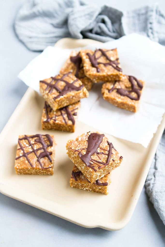 Sweetened with dates and chock full of whole grains, these Chocolate Peanut Butter Oatmeal Bars will curb your sweet tooth in just a few bites. 161 calories and 7 Weight Watchers SP | No Bake | Healthy | Plant Based | Date | Vegan | Recipes | Kamut | Chewy #oatmealbars #datebars #medjooldates #vegansnacks #plantbased
