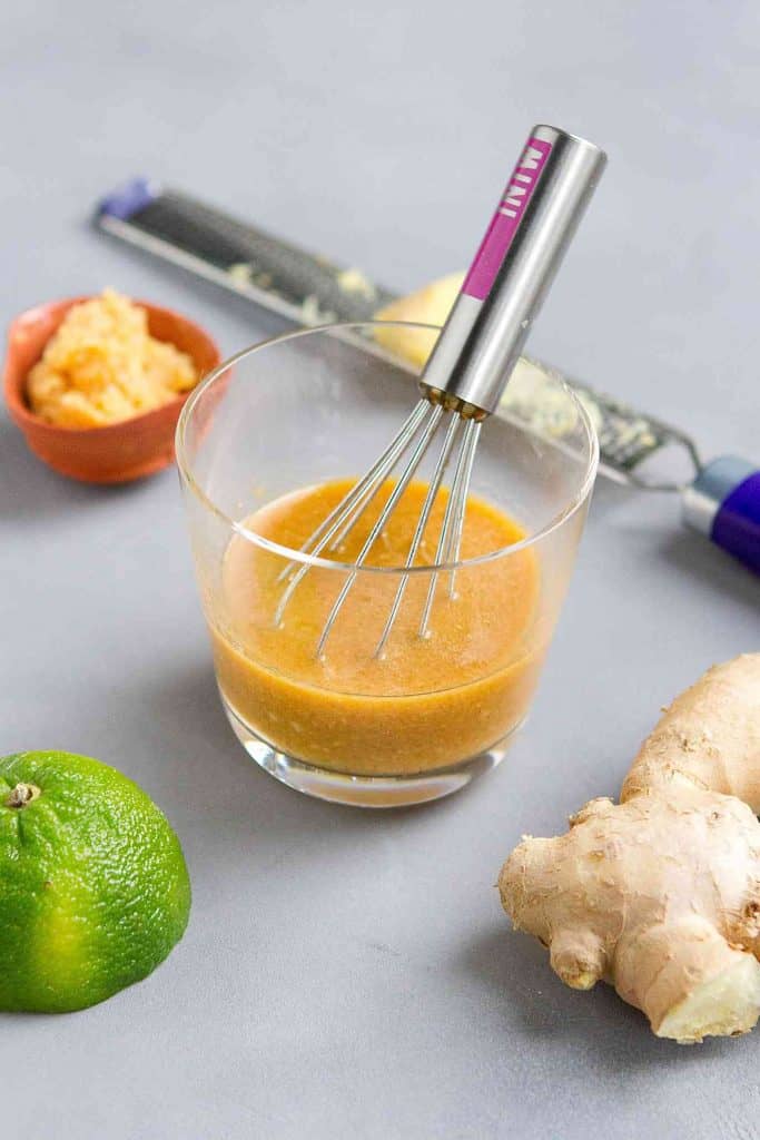 Drizzle this homemade miso ginger dressing over greens, shrimp or chicken for a punch of flavor. 78 calories and 3 Weight Watchers SP | Vegan | Salad Dressing | White Miso | Healthy | Recipes #misodressing #vegandressing #veganrecipes #weightwatchers #smartpoints
