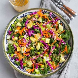 There's so much goodness in this superfood salad. Kale, avocado, cabbage, rice and more, all tossed with a miso dressing. Delicious! 143 calories and 4 Weight Watchers SP | Vegan | Plant Based | Anti Inflammatory | Mediterranean Diet | Recipe | Lunch Ideas | Meal Prep #plantbased #vegansalads #lunchideas #antiinflammatory #wwrecipes #smartpoints