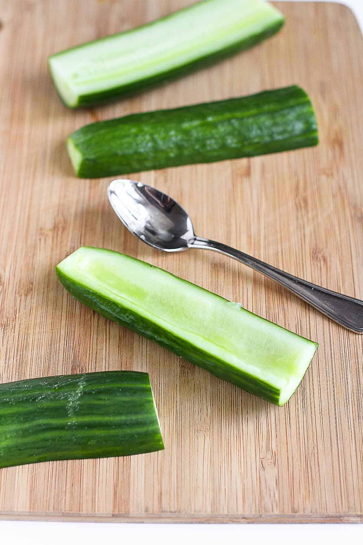 English cucumber halves with the seeds scooped out.