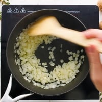 Stirring onions in a nonstick saucepan
