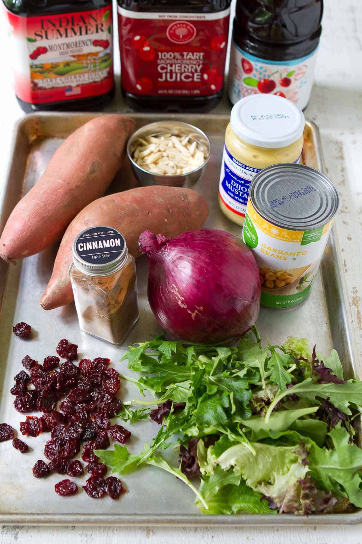 Ingredients for sweet potato salad on baking sheet.