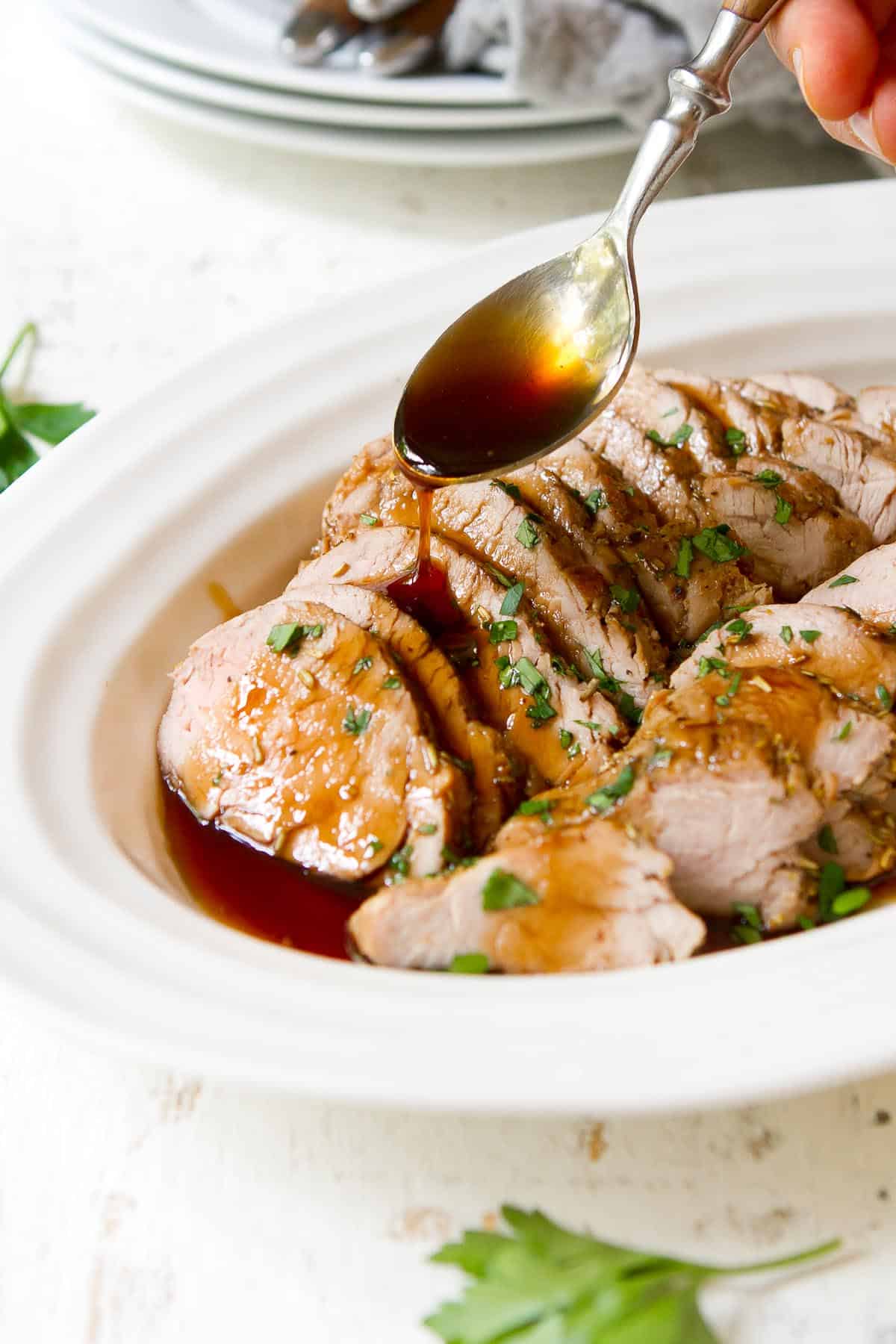 Oven roasted pork tenderloin gets all dressed up with an easy maple balsamic glaze. Lean, delicious, quick to make and impressive enough to serve to guests! | Recipes in oven | Sauce | Balsamic vinegar