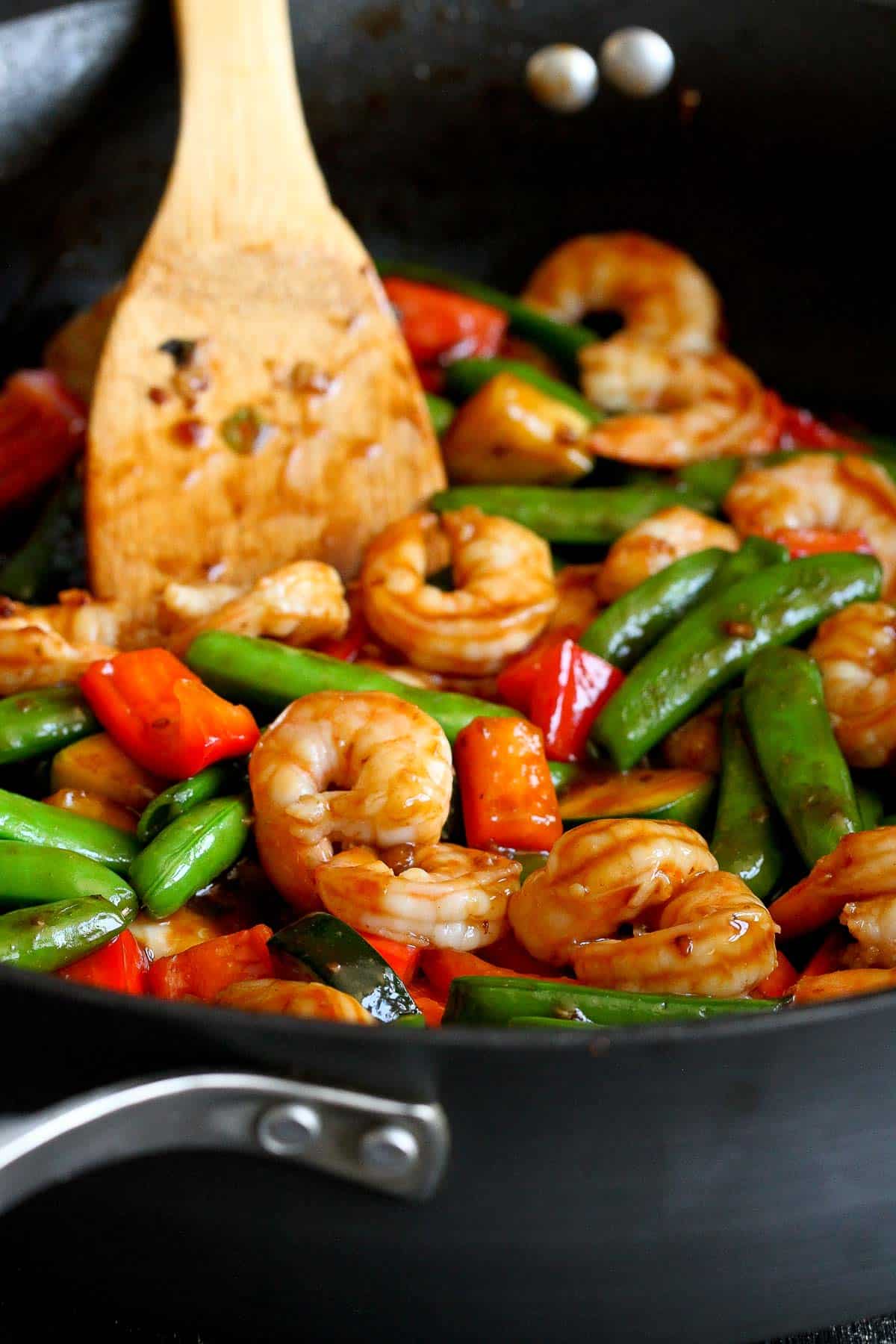 Shrimp, snap peas, zucchini and bell pepper in a nonstick skillet.