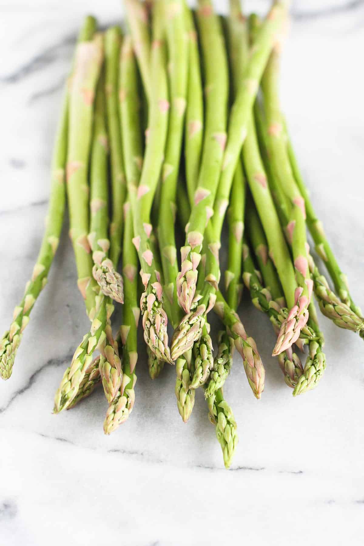 Asparagus spears on a white background.