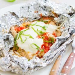 Chicken breasts with tomatoes and mozzarella in foil.