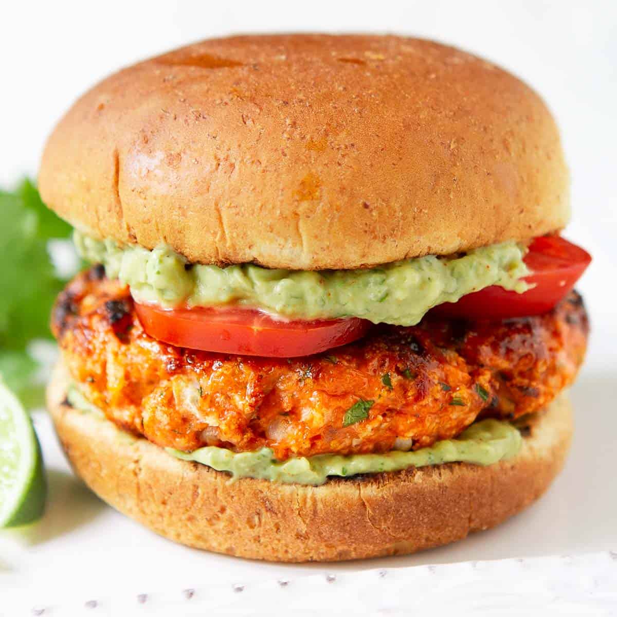 Grilled Salmon Burgers with Avocado Sauce - Cookin Canuck