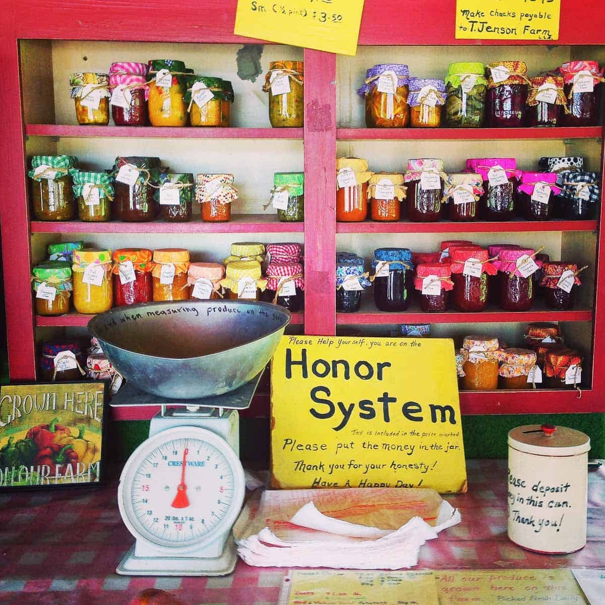 Jelly jars at a farmstand.