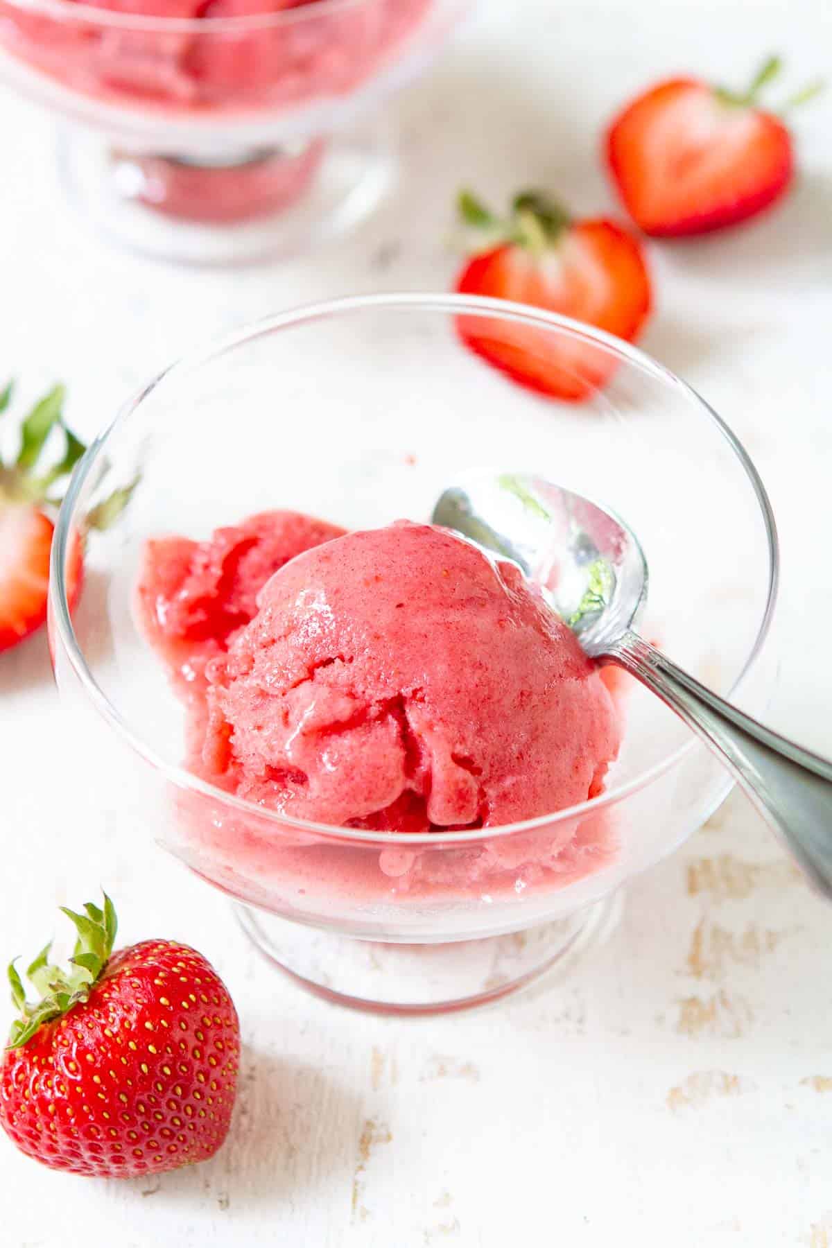 Strawberry nice cream is an easy, healthy summertime treat! It's made with fresh fruit and is a fantastic option for a plant-based and dairy-free dessert. | Vegan | Nice cream strawberry banana | Nice cream recipes strawberry | Nice cream recipes healthy strawberry