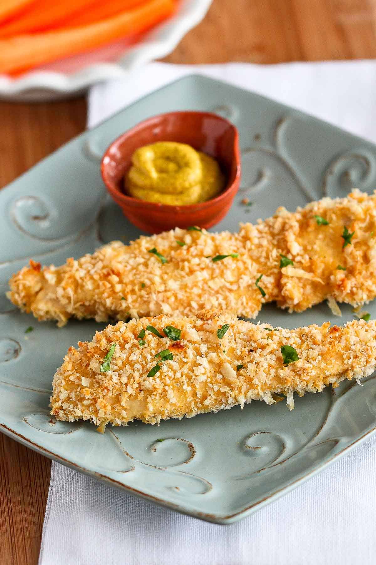 Crispy, delicious, and healthier than traditional fried chicken strips - check out this easy recipe for baked panko chicken strips that the whole family will love! | Recipes dinner | Recipes healthy | Recipes tenders