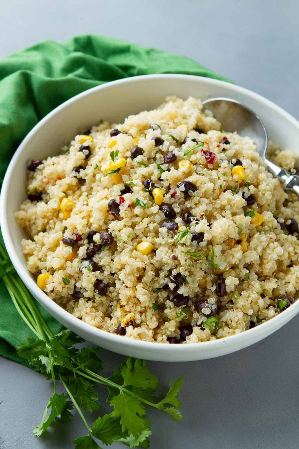 Spice up your outdoor gatherings with this mouthwatering southwest quinoa salad, featuring black beans, corn, and a zesty lime juice dressing. | Recipes | Plant-based | WFPB | Vegan