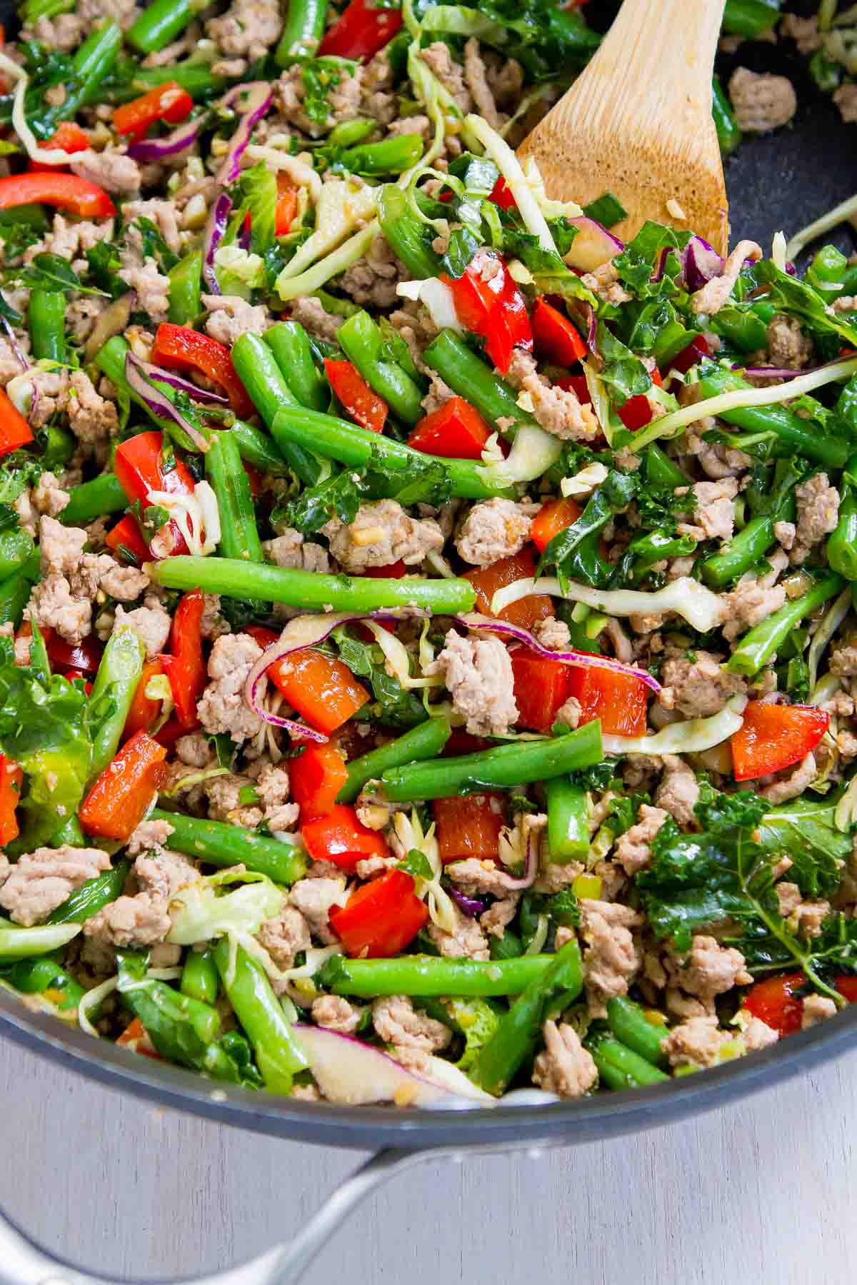 Ground turkey and vegetable stir-fry in a large skillet.