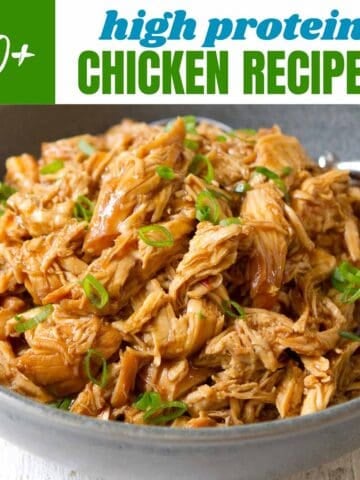 Shredded chicken with hoisin sauce in a gray bowl.