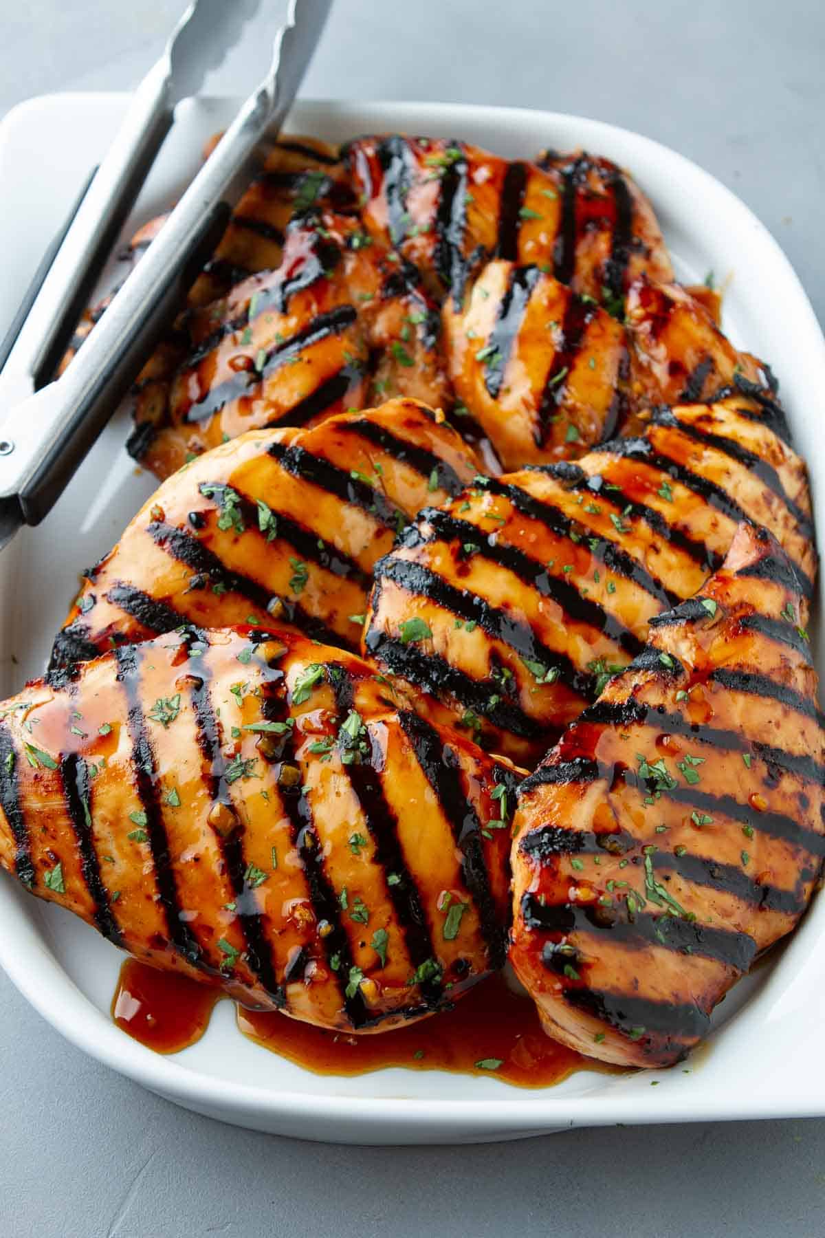 Grilled soy sauce chicken is a must for any backyard bbq meal. The chicken is marinated in a sweet and savory soy honey marinade, cooked until tender and juicy and drizzled with the thickened sauce.