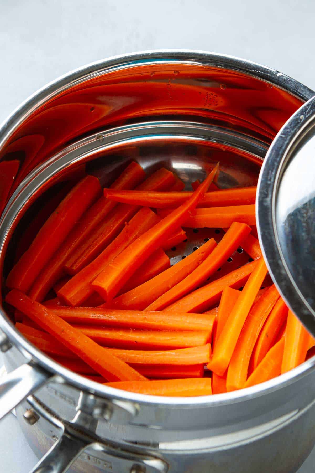 Carrots in a double boiler-style steamer.