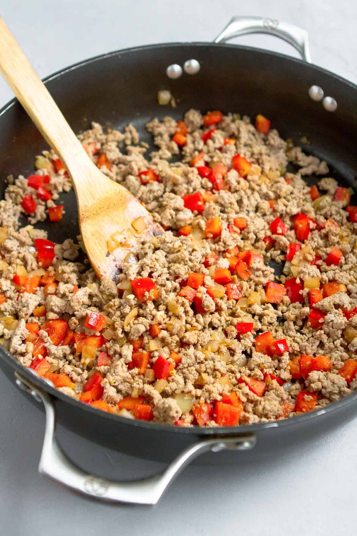 Ground turkey, bell pepper and onion in a large nonstick skillet.