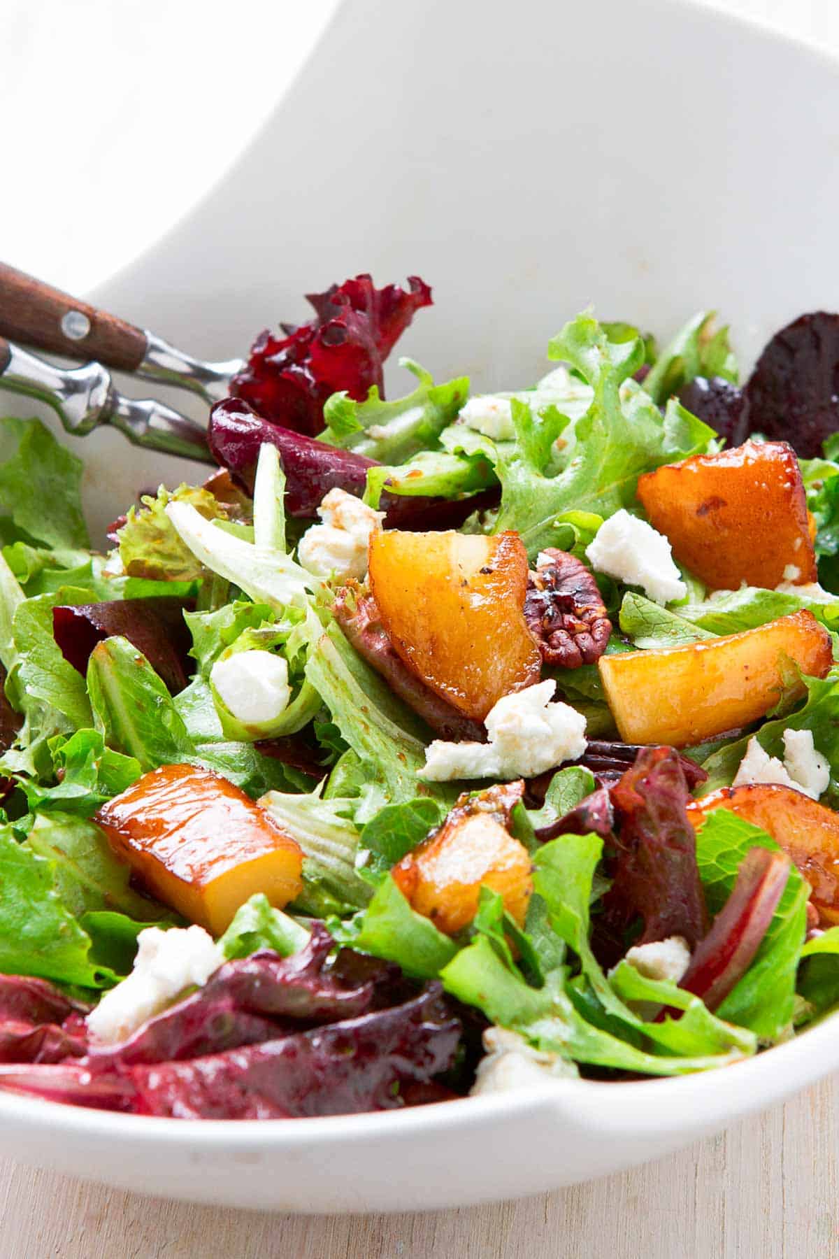 The ultimate fall salad! This maple pear and goat cheese salad gets rave reviews every time I serve it.  It pairs well with almost any main dish. | Recipes | Fall | Dressing | Autumn | Dressing vinaigrette 