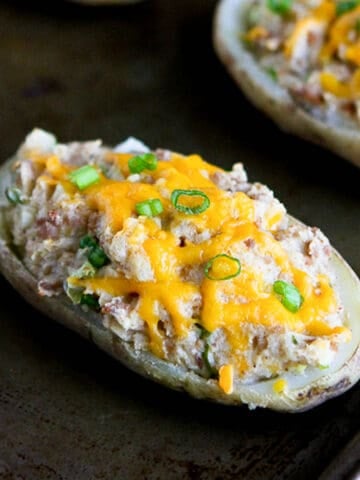 Potato skins filled with ground turkey and mashed potatoes, and topped with cheese.