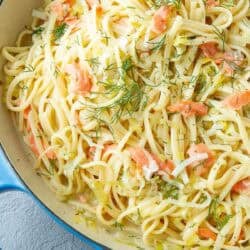 Linguini with smoked salmon and dill in a skillet.