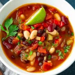 Three bean soup in a white bowl.