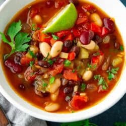 Three bean soup in a white bowl.